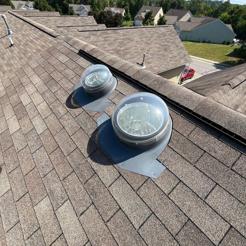 Roof skylight domes on shingle roof with flashing
