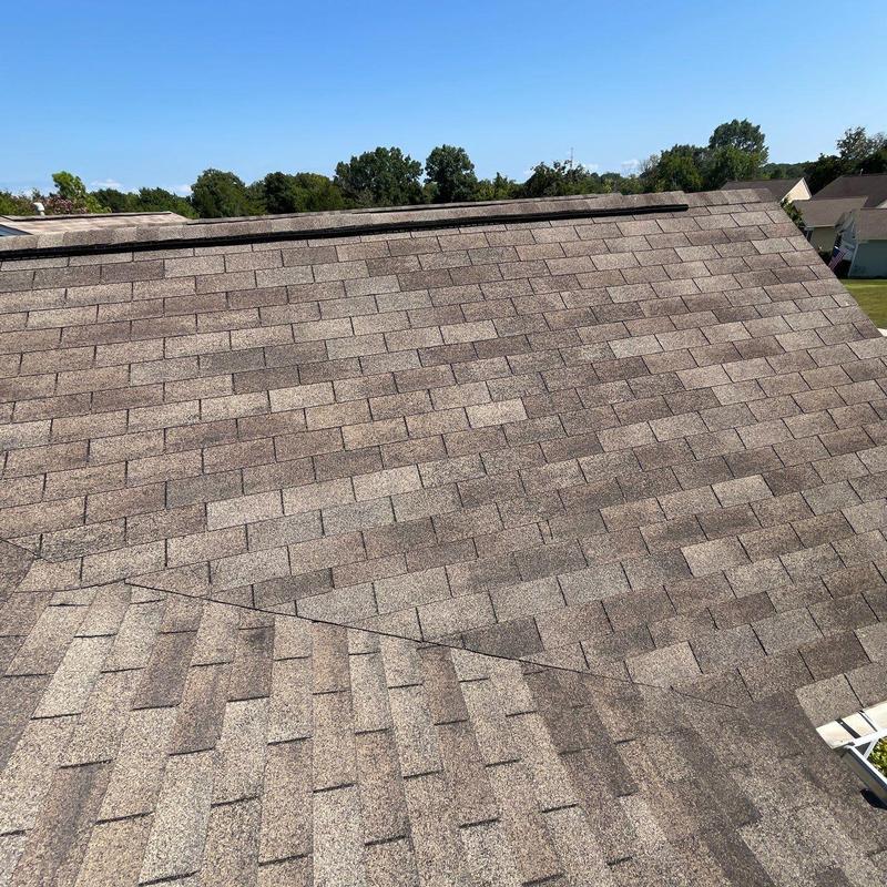 Asphalt shingle roof with hail damage inspection