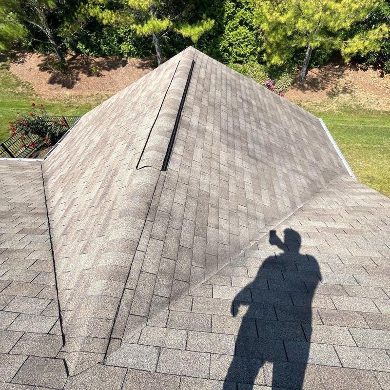 Asphalt shingle roof with ridge vent and minor wear