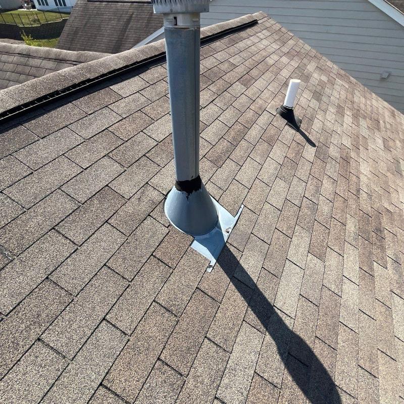 Roof flashing with hail damage and shingle wear