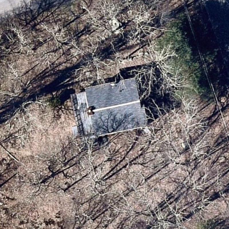 Roof shingles inspection on wooded property aerial view Roof shingles inspection on wooded property aerial view