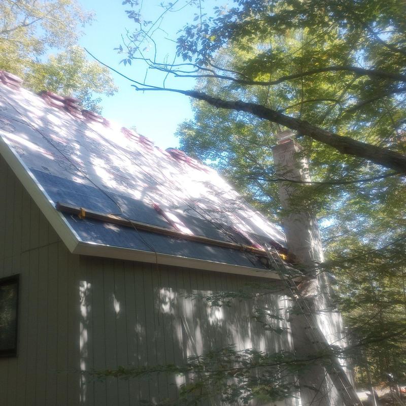 Roof underlayment installation on steep residential roof Roof underlayment installation on steep residential roof