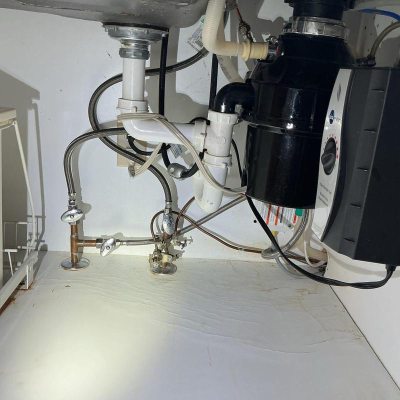 Kitchen drain pipes and garbage disposal installation