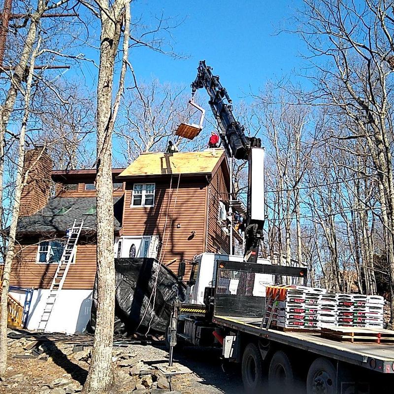 Roof decking installation on residential home with crane Roof decking installation on residential home with crane