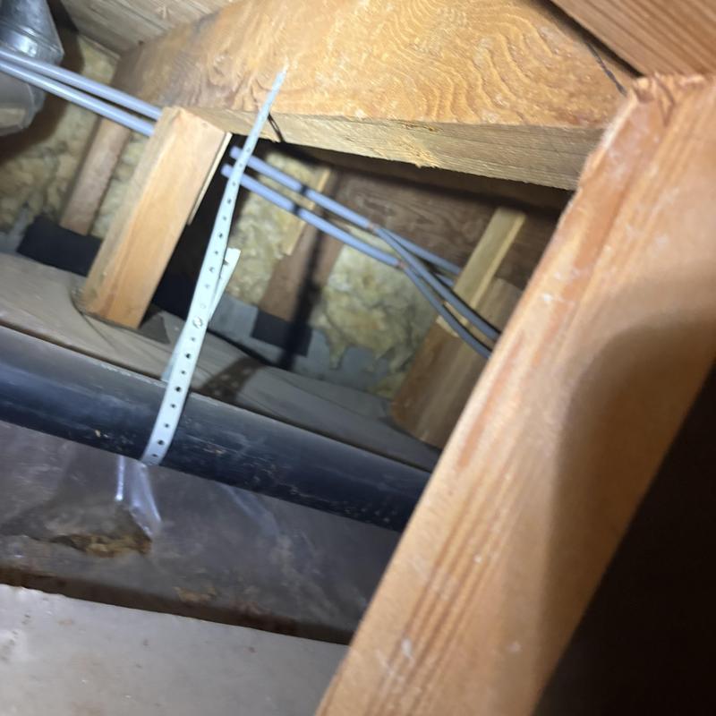 Polybutylene water lines inside opened wall cavity