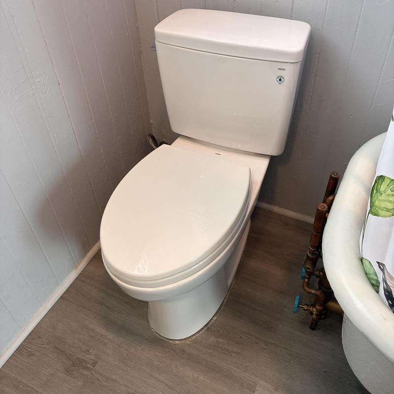 Toto Drake elongated toilet installed in residential bathroom Toto Drake elongated toilet installed in residential bathroom