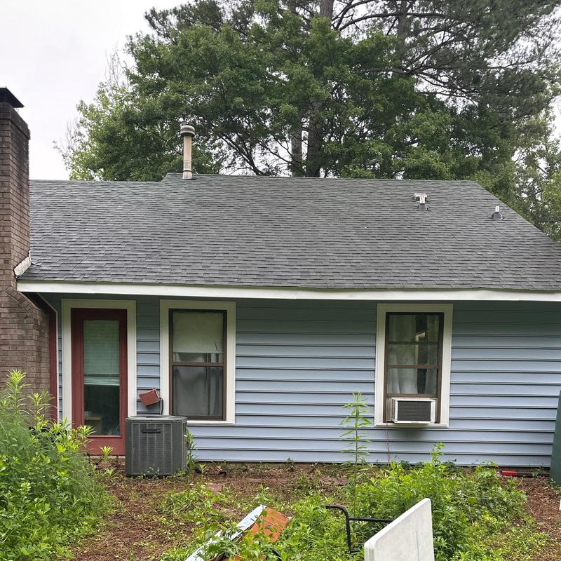 Vinyl siding and windows on residential house exterior Vinyl siding and windows on residential house exterior