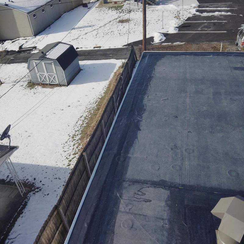 EPDM roofing membrane installation on flat roof