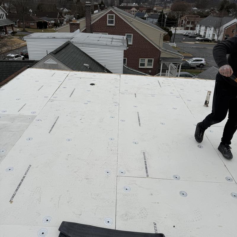 EPDM roof insulation mechanically fastened on flat roof