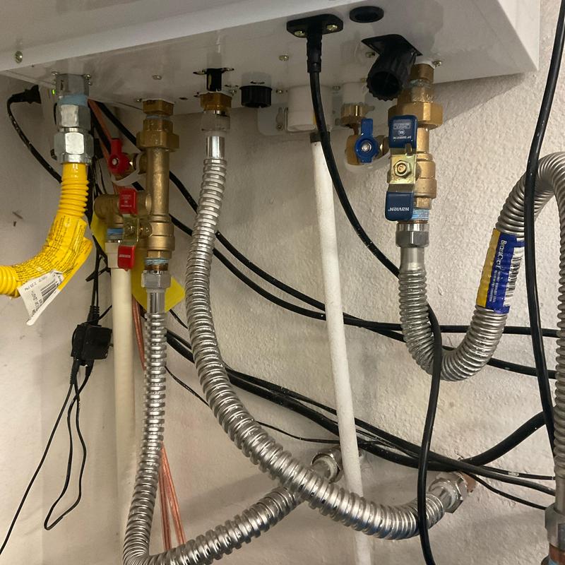 Condensation line with brass valves and flexible connectors