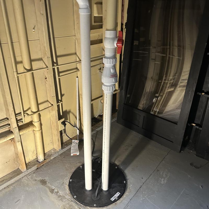 Sewer ejector pump pipes and valve installation