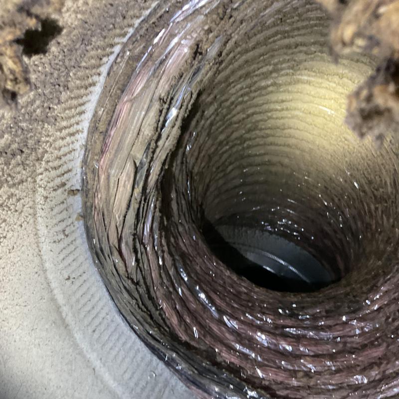 Flexible duct interior with dust buildup before cleaning