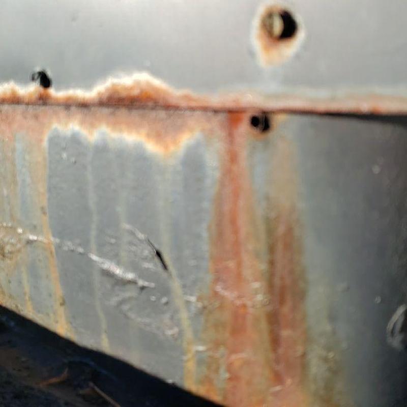 Rust damage on metal pipe jack flashing panel