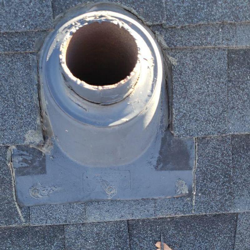 Roof pipe jack with sealed flashing on shingle roof