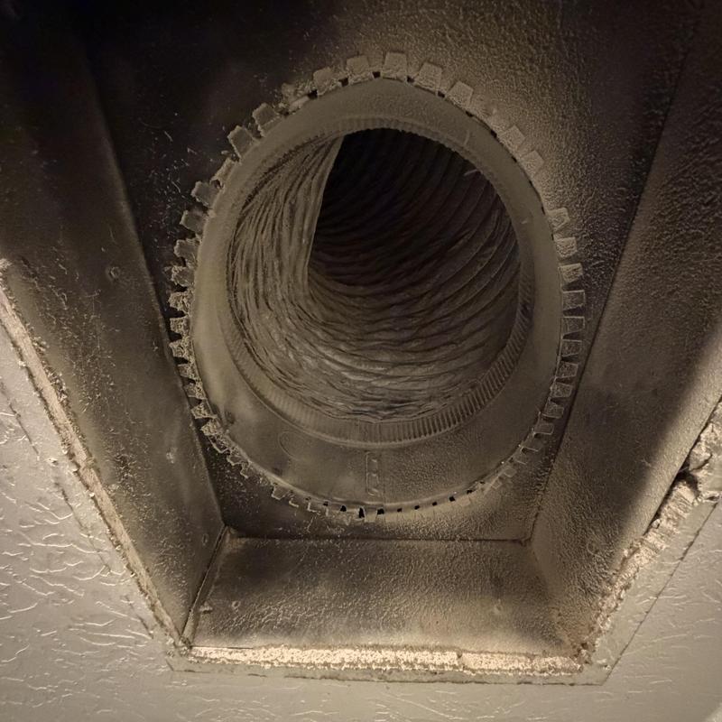 Return air duct with dust buildup in crawlspace