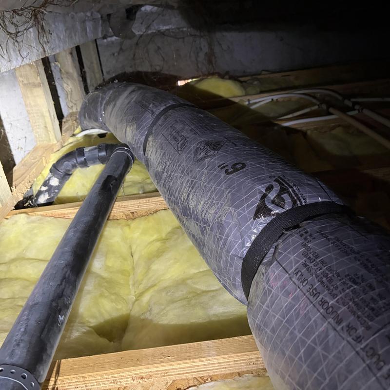 Furnace flue duct in crawlspace with insulation