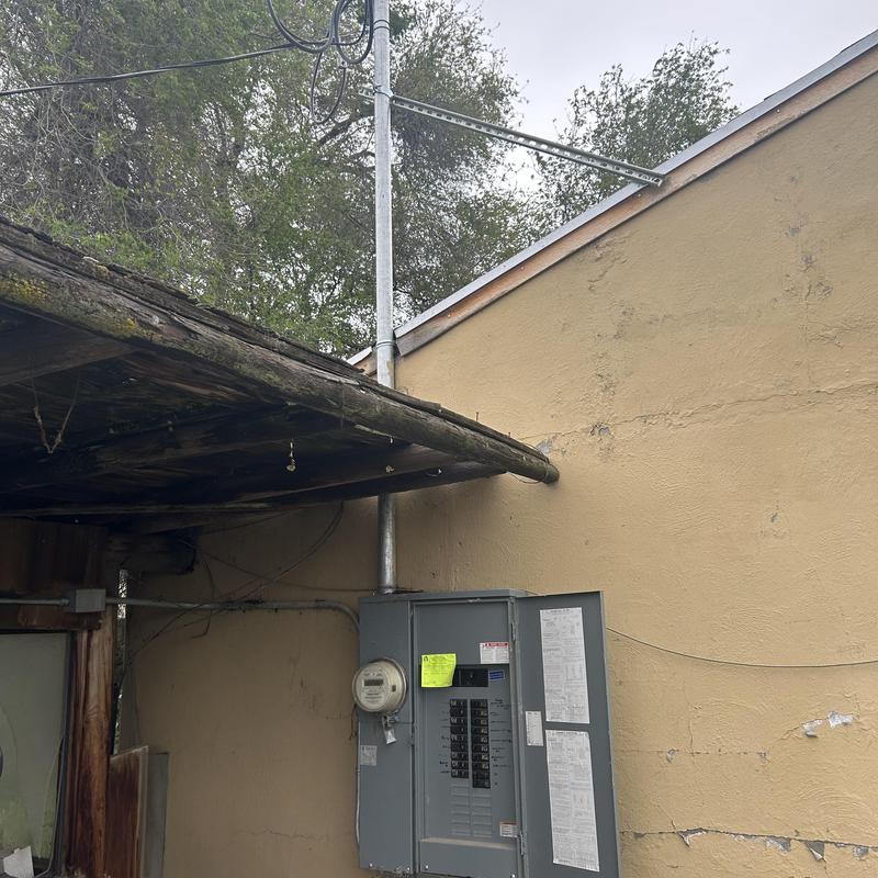 Electrical breaker panel with meter on exterior wall