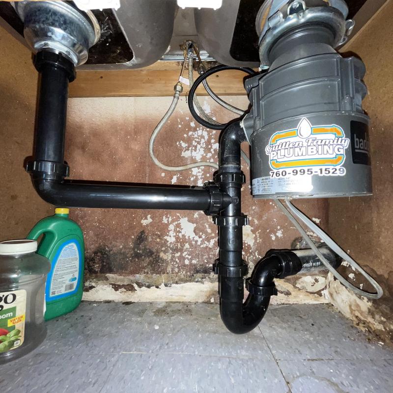 Kitchen sink drain and garbage disposal plumbing system