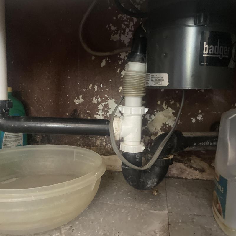 Kitchen sink basket strainer and drain pipes installed