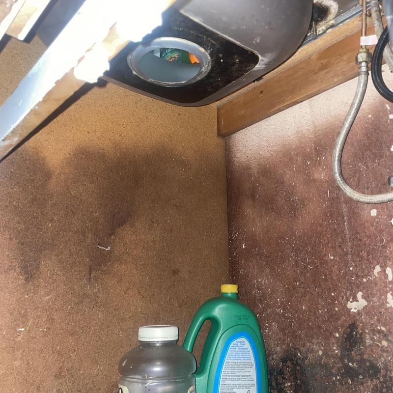 Kitchen sink drain and strainer replacement under sink