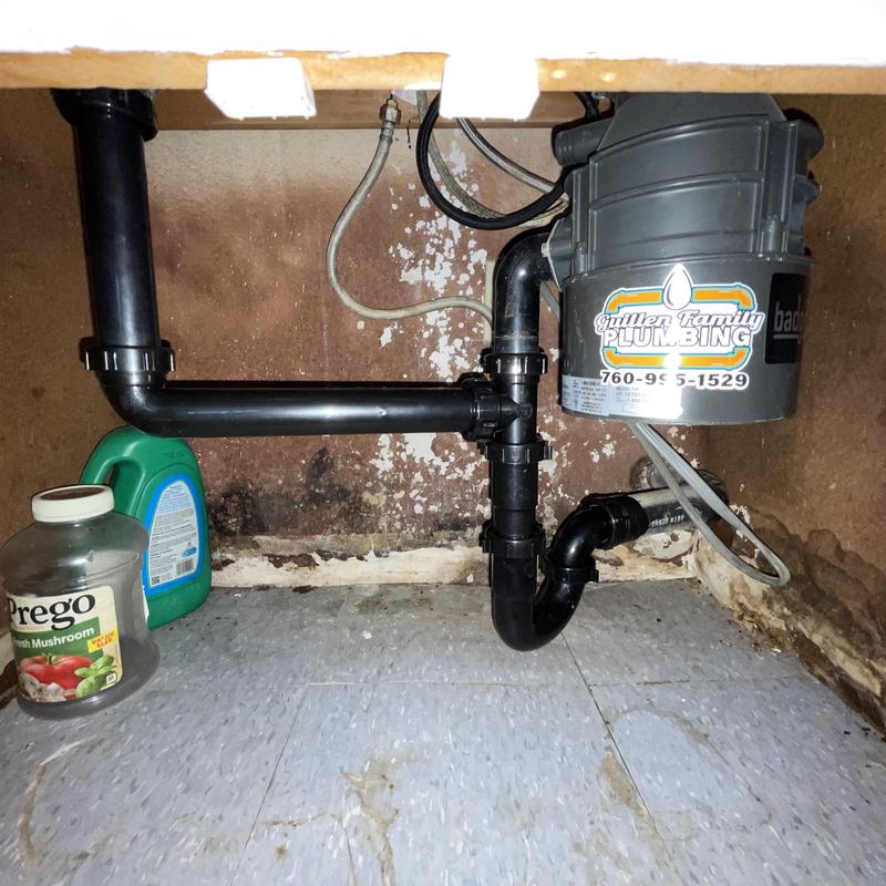Kitchen sink drain lines and garbage disposal installation