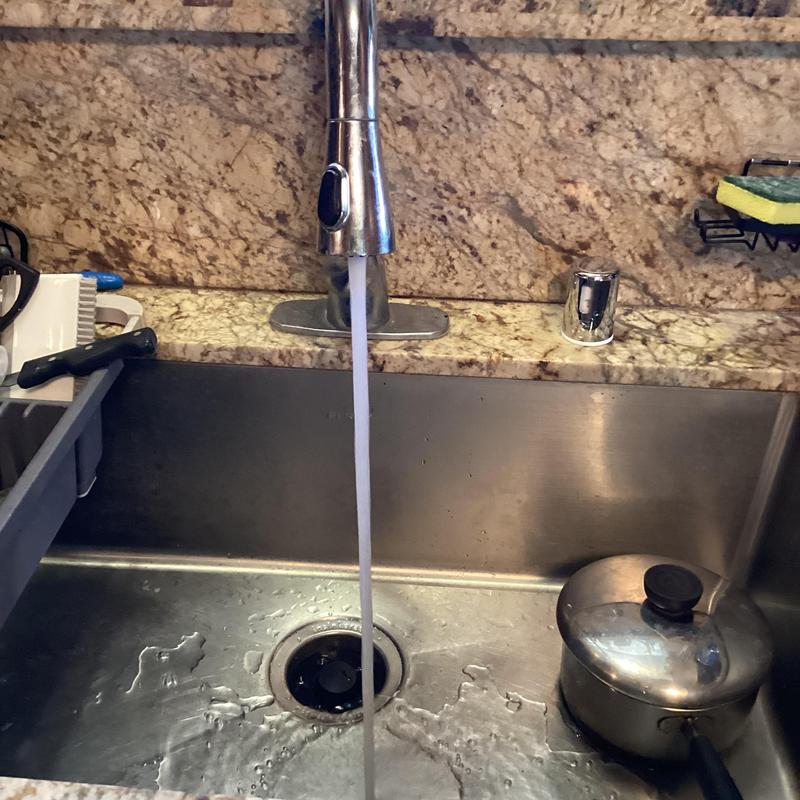 Garbage disposal and drain lines under kitchen sink