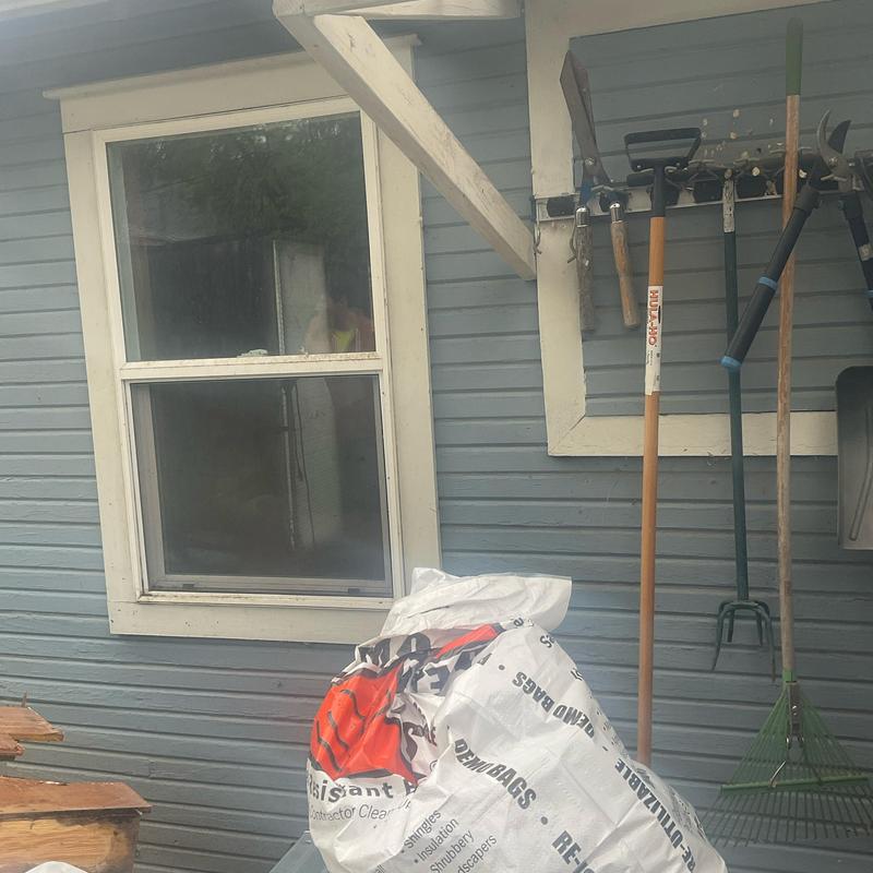 Window installation on detached garage exterior wall