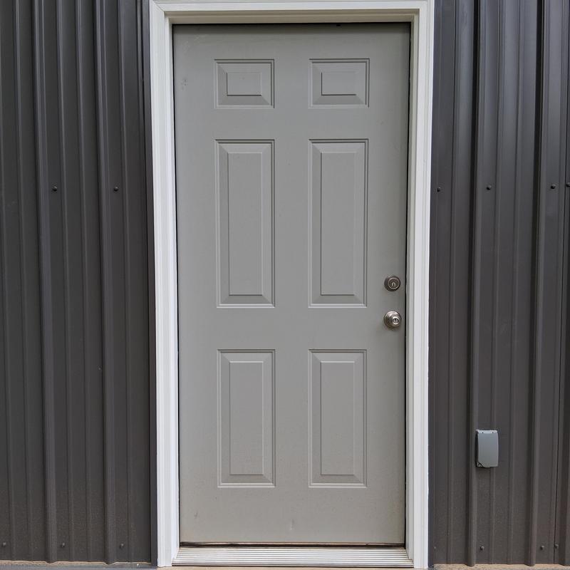 Door casing with caulked putty holes and primer paint