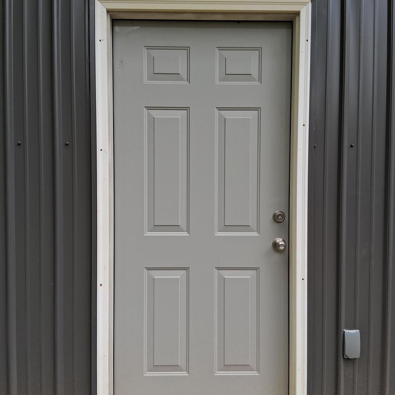 Door casing with exterior primer and caulked putty holes