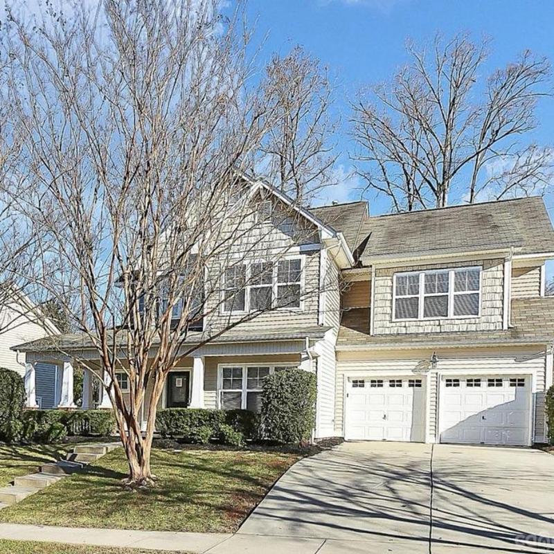 Asphalt shingle roof with discoloration and wear