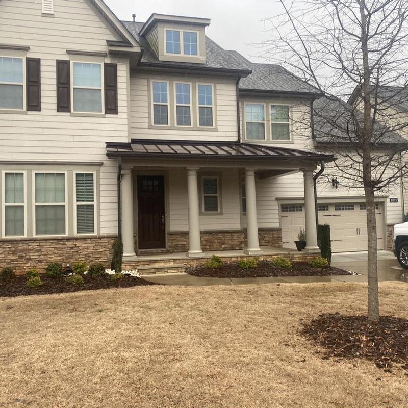 House gutters with stone and siding exterior in winter