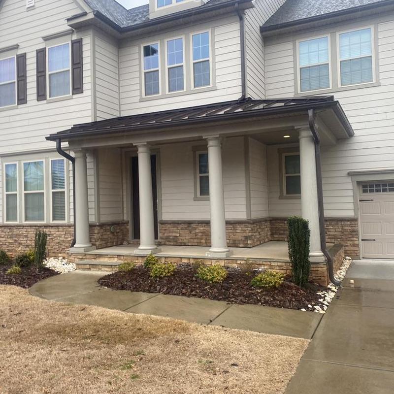 Gutter and fascia board repair on porch roof