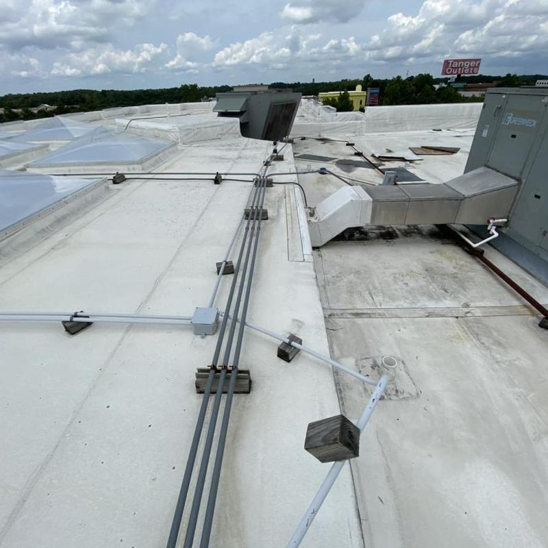 TPO commercial roof with HVAC duct and conduit lines