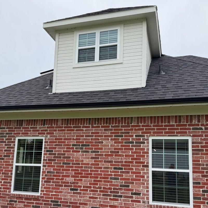 Burris vinyl energy-efficient windows in brick home