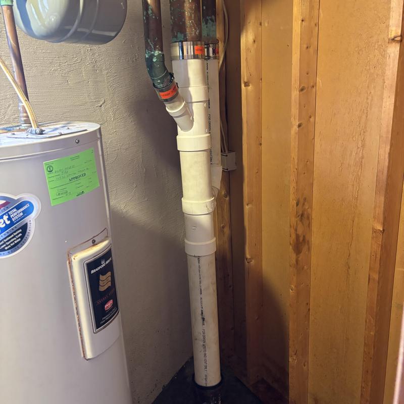 Plumbing stack replacement near water heater in basement