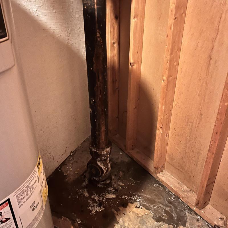 Plumbing stack with water damage near wall framing