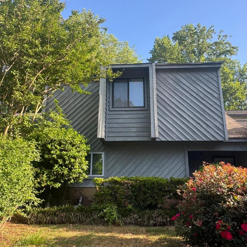 Wood siding exterior with window and greenery