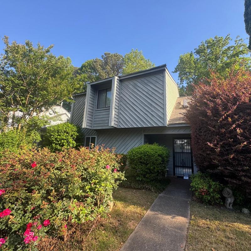 Roof siding and window inspection with landscaping