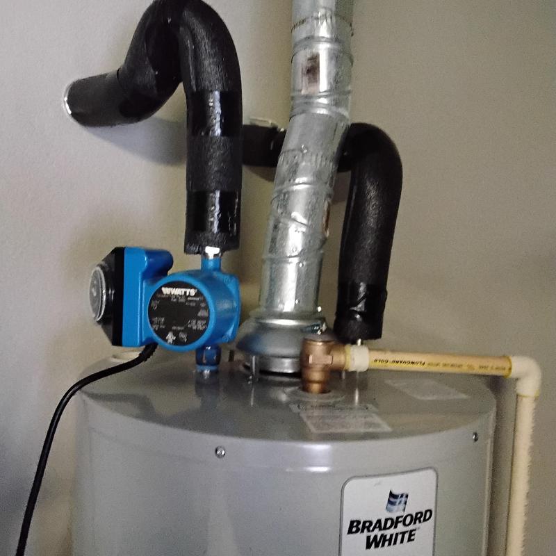 Gas water heater with pump and insulated pipes installation