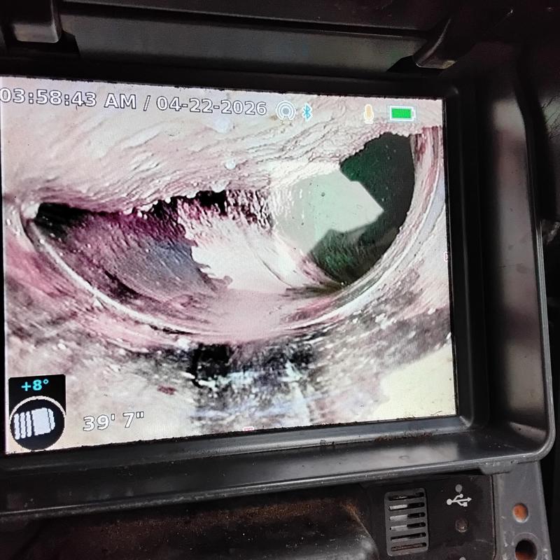 Main sewer line inspection with camera showing grease buildup