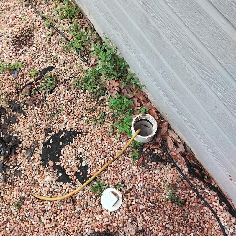 Sewer cleanout with hydrostatic test hose inserted