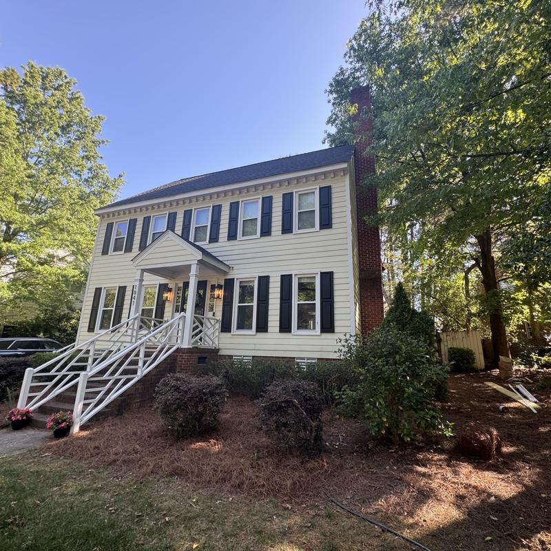 Vinyl siding and shutters on two-story house Vinyl siding and shutters on two-story house