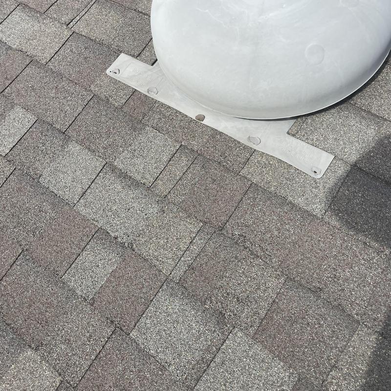 Roof vent flashing and shingle repair on asphalt roof
