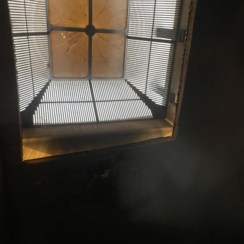 Roof vent with damaged flashing and water stains