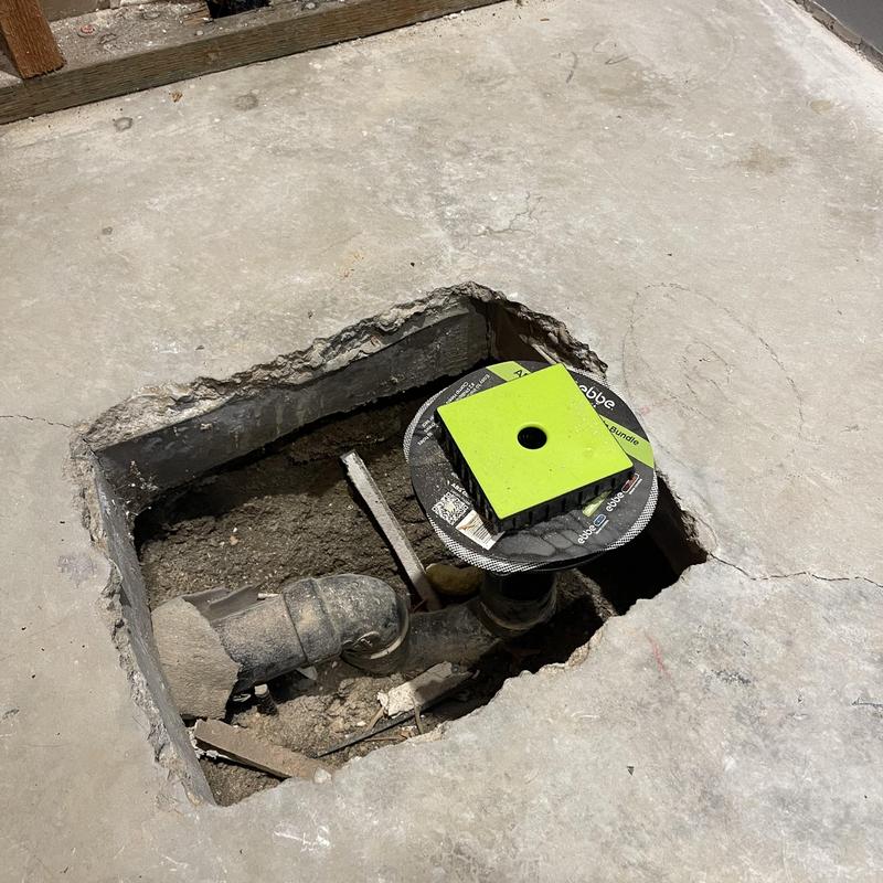 Ebbe shower rough-in drain set in concrete floor cutout