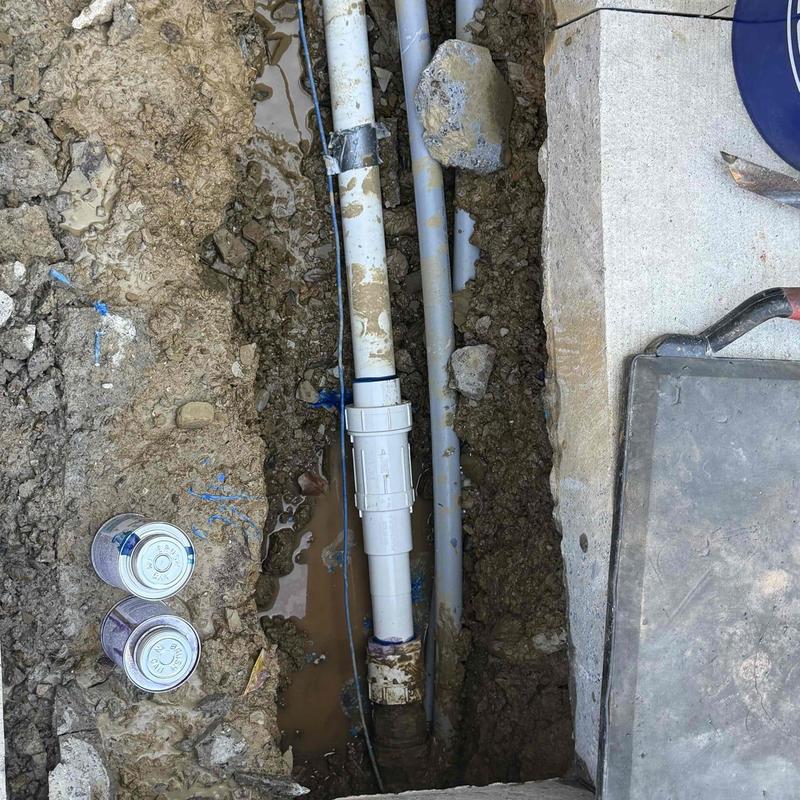 PVC underground plumbing pipes in trench repair