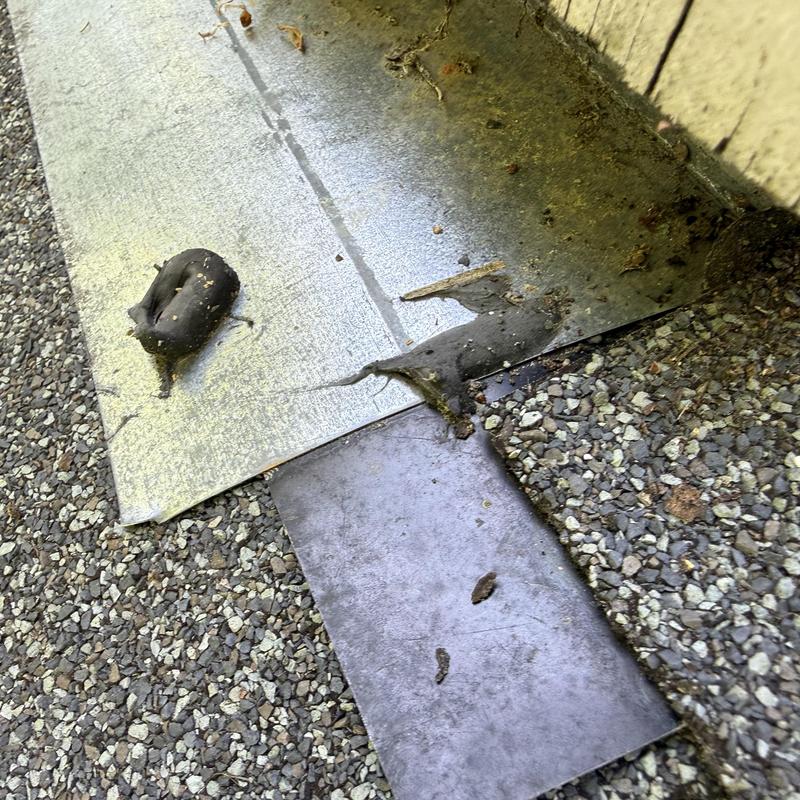 Chimney flashing metal with old sealant residue