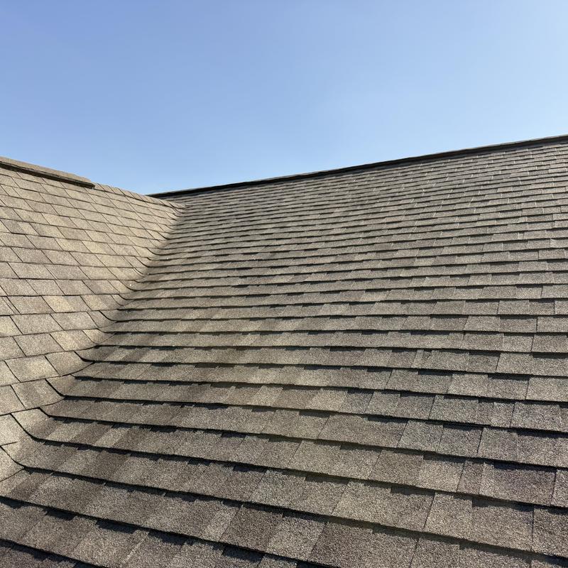 Asphalt shingle roof with no hail damage, clear sky