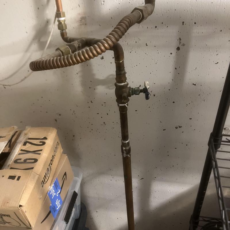 Shut off valve and copper piping in basement utility area