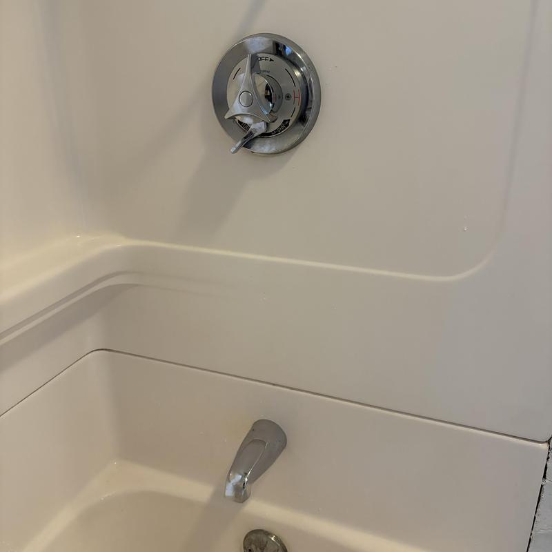 Shower valve and tub spout with repaired handle